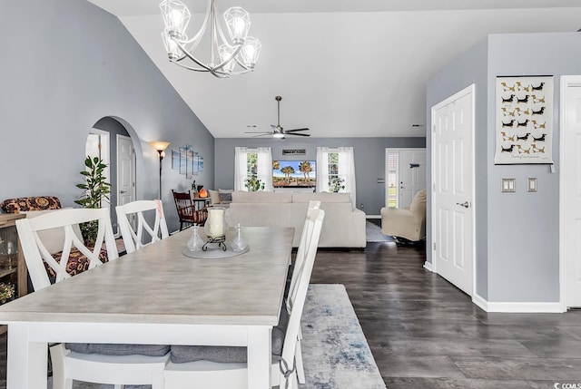 3907 Stillwood Dr, Myrtle Beach, SC 29588 - dining space with lofted ceiling, arched walkways, a ceiling fan, a chandelier, and dark wood finished floors