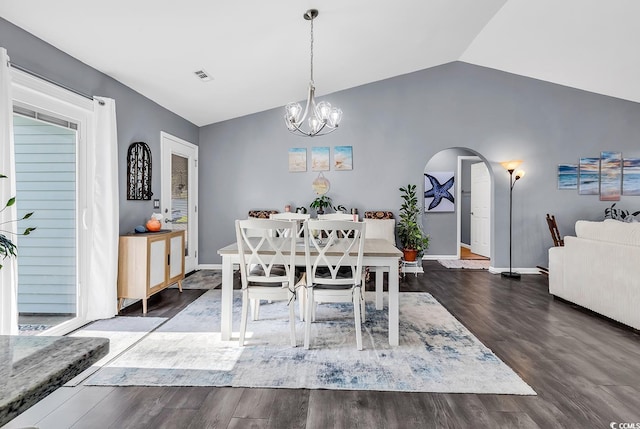 3907 Stillwood Dr, Myrtle Beach, SC 29588 - dining room featuring lofted ceiling, arched walkways, wood finished floors, and a chandelier