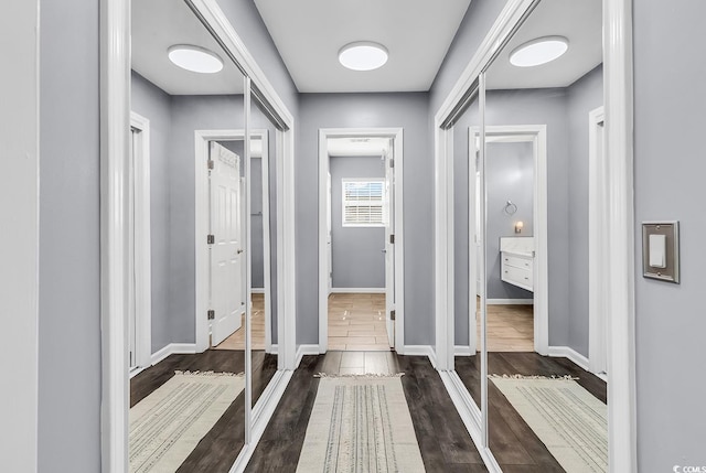 3907 Stillwood Dr, Myrtle Beach, SC 29588 - hallway with dark wood-type flooring and baseboards