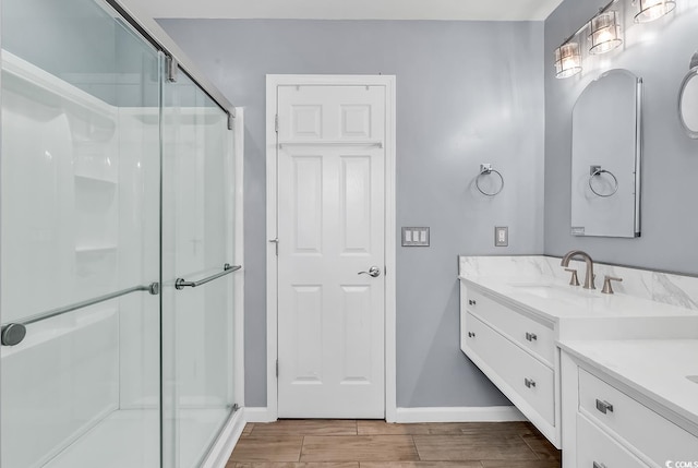 3907 Stillwood Dr, Myrtle Beach, SC 29588 - bathroom featuring a stall shower, vanity, and wood tiled floors