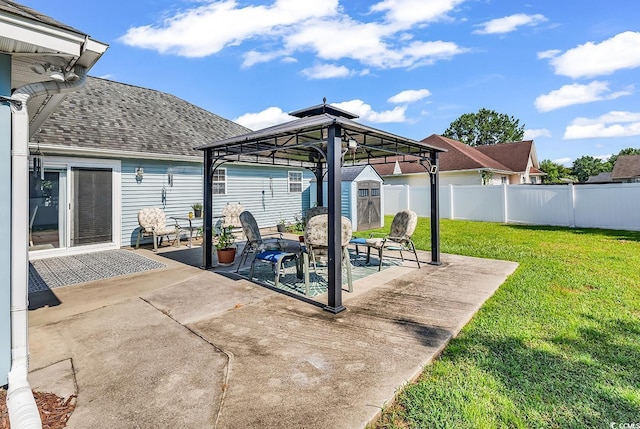 3907 Stillwood Dr, Myrtle Beach, SC 29588 - fenced backyard with a patio, a storage shed, and a gazebo