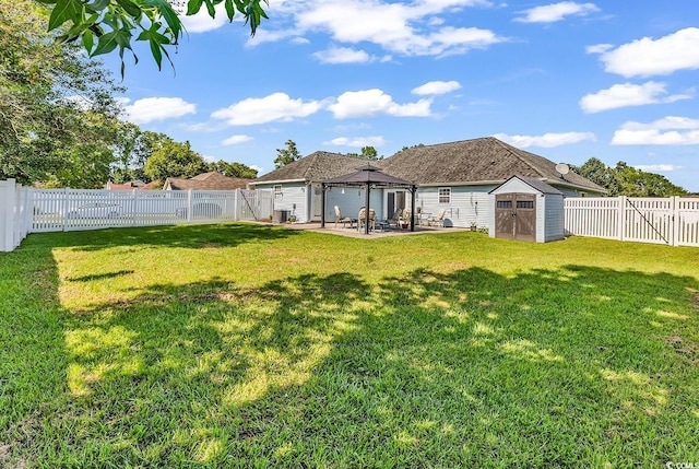 3907 Stillwood Dr, Myrtle Beach, SC 29588 - rear view of property with a shed, a gazebo, a patio, and a fenced backyard