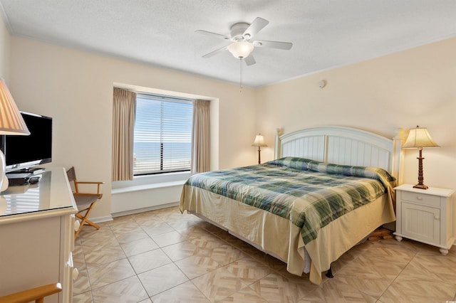 1820 N Ocean Blvd Unit 303D, North Myrtle Beach, SC 29582 - bedroom with an office area, a ceiling fan, and a textured ceiling