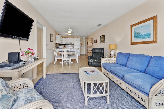 1820 N Ocean Blvd Unit 303D, North Myrtle Beach, SC 29582 - living room featuring a ceiling fan and light tile patterned flooring