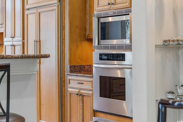 350 Saint Julian Ln, Myrtle Beach, SC 29579 - kitchen featuring built in appliances, dark stone counters, and a warming drawer