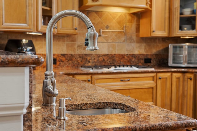 350 Saint Julian Ln, Myrtle Beach, SC 29579 - kitchen featuring tasteful backsplash, glass insert cabinets, and dark stone counters