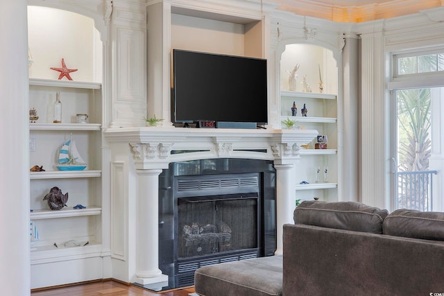 350 Saint Julian Ln, Myrtle Beach, SC 29579 - living area featuring built in shelves, wood finished floors, a fireplace, and ornamental molding