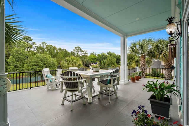 350 Saint Julian Ln, Myrtle Beach, SC 29579 - patio / terrace featuring outdoor dining space and view of wooded area