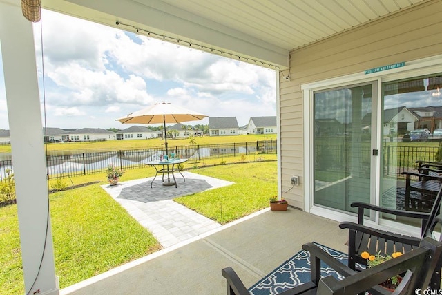 435 Rollins Dr, Longs, SC 29568 - fenced backyard featuring a patio area, a water view, and a residential view