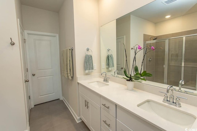 435 Rollins Dr, Longs, SC 29568 - bathroom with tile patterned floors, double vanity, and a stall shower