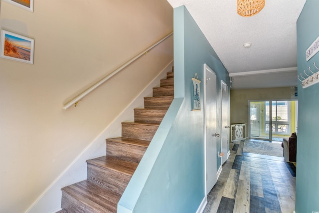 832 Villa Dr Unit 832, North Myrtle Beach, SC 29582 - staircase featuring wood finished floors