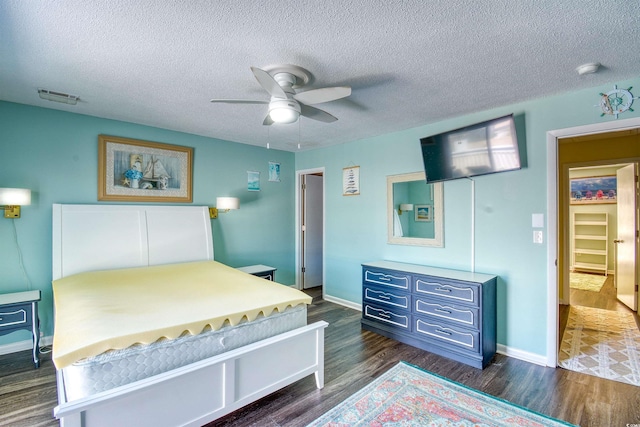 832 Villa Dr Unit 832, North Myrtle Beach, SC 29582 - bedroom with dark wood-style flooring, a textured ceiling, and a ceiling fan