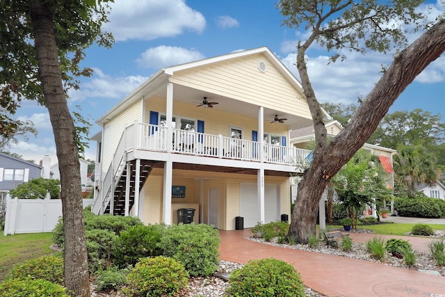 505 41st Ave S, North Myrtle Beach, SC 29582 - view of front of property featuring ceiling fan, a porch, an attached garage, and stairs