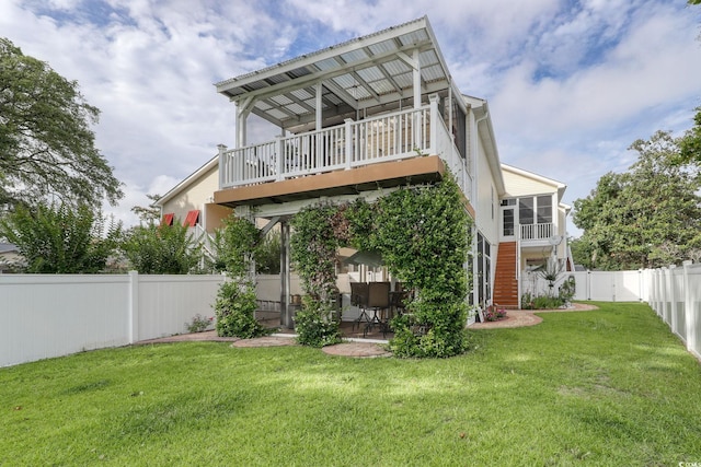 505 41st Ave S, North Myrtle Beach, SC 29582 - rear view of property with a fenced backyard, a patio area, and a balcony