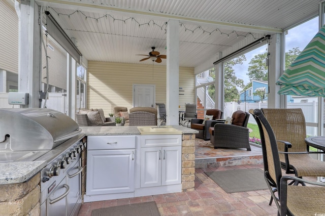 505 41st Ave S, North Myrtle Beach, SC 29582 - view of patio featuring area for grilling, a ceiling fan, stairway, and outdoor lounge area