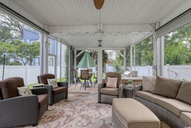 505 41st Ave S, North Myrtle Beach, SC 29582 - sunroom featuring outdoor lounge area, a ceiling fan, outdoor dining area, and exterior kitchen