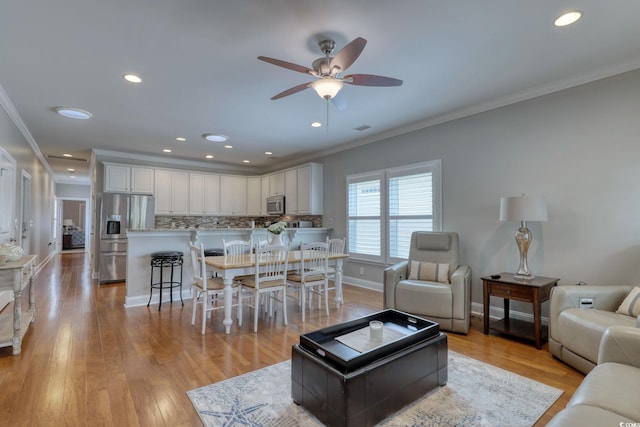505 41st Ave S, North Myrtle Beach, SC 29582 - living area featuring a ceiling fan, ornamental molding, light wood-style floors, and recessed lighting