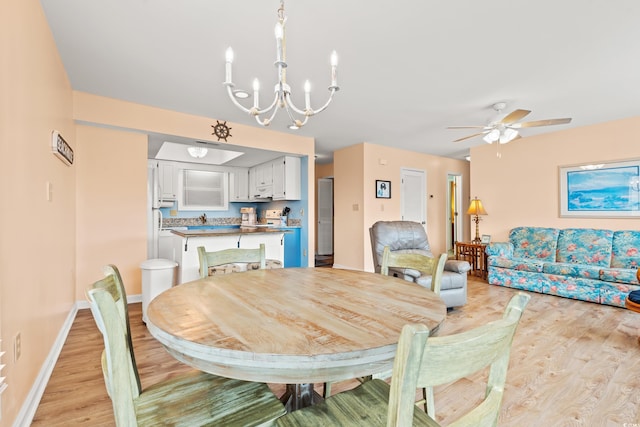 212 29th Ave N Unit 204, North Myrtle Beach, SC 29582 - dining space with light wood finished floors, a chandelier, and a ceiling fan
