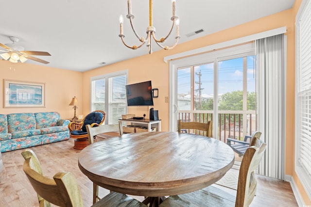 212 29th Ave N Unit 204, North Myrtle Beach, SC 29582 - dining space with light wood finished floors, a chandelier, and ceiling fan