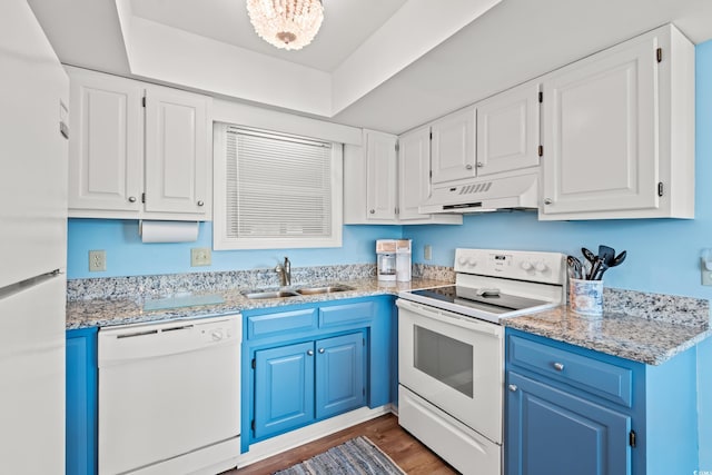 212 29th Ave N Unit 204, North Myrtle Beach, SC 29582 - kitchen featuring white appliances, custom exhaust hood, blue cabinets, white cabinets, and wood finished floors