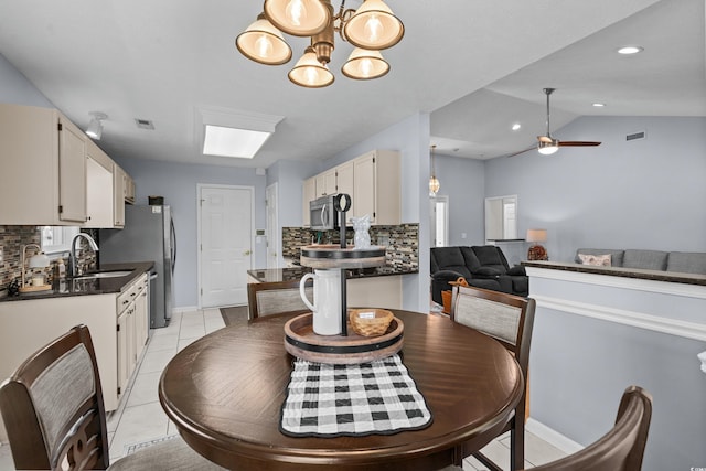 483 Oakmont Dr, Myrtle Beach, SC 29579 - dining area with light tile patterned flooring, a chandelier, ceiling fan, vaulted ceiling, and recessed lighting