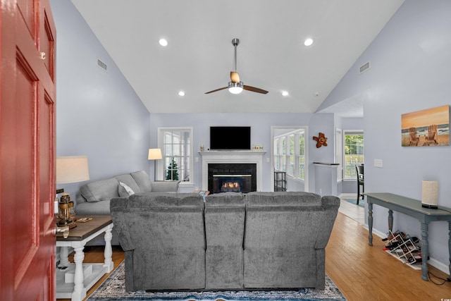 483 Oakmont Dr, Myrtle Beach, SC 29579 - living area with ceiling fan, a glass covered fireplace, light wood finished floors, recessed lighting, and high vaulted ceiling