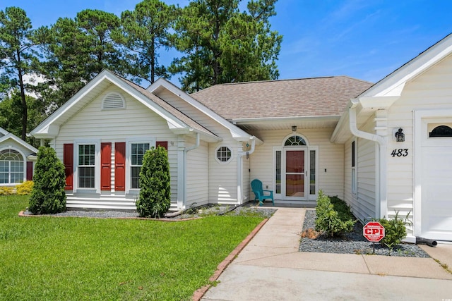 483 Oakmont Dr, Myrtle Beach, SC 29579 - view of front of home with a shingled roof, a front lawn, and a garage