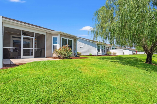 1590 Palmina Loop Unit A, Myrtle Beach, SC 29588 - view of grassy yard featuring a ceiling fan and a sunroom