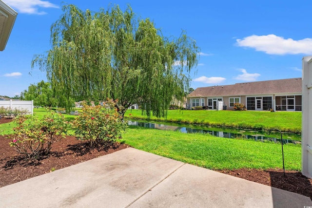 1590 Palmina Loop Unit A, Myrtle Beach, SC 29588 - view of green lawn with a water view and a patio