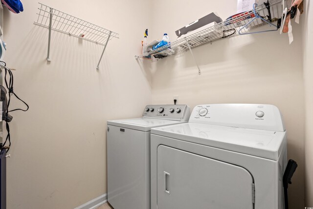 1590 Palmina Loop Unit A, Myrtle Beach, SC 29588 - washroom featuring washing machine and clothes dryer and baseboards