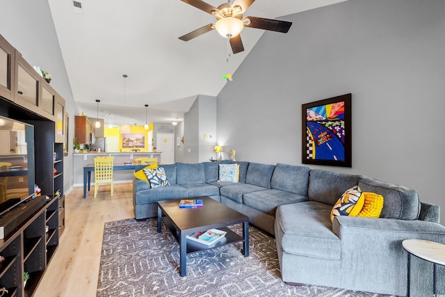 1590 Palmina Loop Unit A, Myrtle Beach, SC 29588 - living room with high vaulted ceiling, a ceiling fan, and light wood-style floors