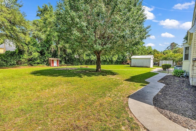 203 Lakeland Dr, Conway, SC 29526 - view of green lawn with a storage unit