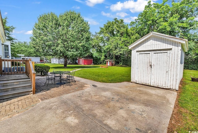 203 Lakeland Dr, Conway, SC 29526 - view of patio featuring a shed, outdoor dining space, and a wooden deck