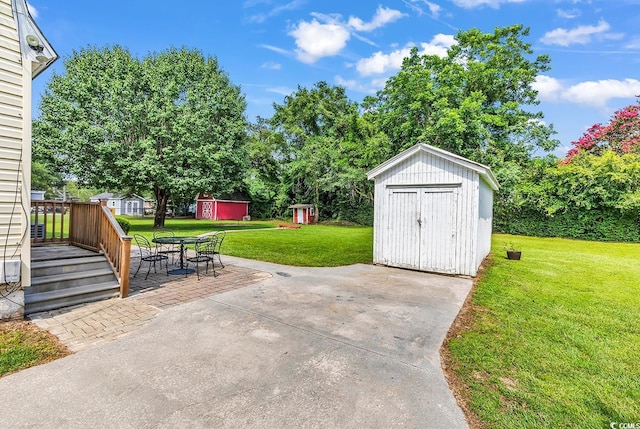203 Lakeland Dr, Conway, SC 29526 - view of patio / terrace featuring a storage unit and view of scattered trees