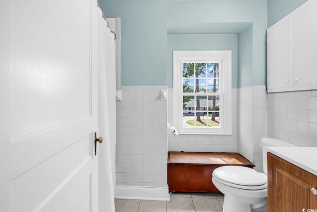 203 Lakeland Dr, Conway, SC 29526 - full bathroom featuring tile walls, tile patterned flooring, vanity, and a wainscoted wall