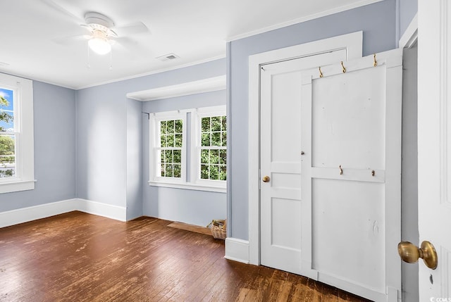 203 Lakeland Dr, Conway, SC 29526 - unfurnished bedroom featuring multiple windows, wood-type flooring, ornamental molding, and ceiling fan