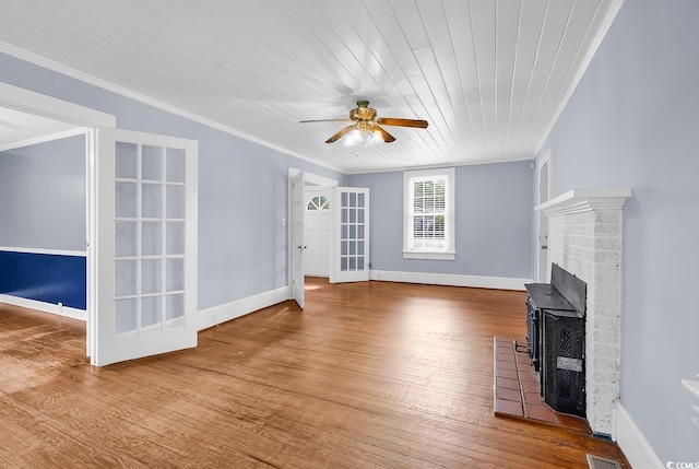 203 Lakeland Dr, Conway, SC 29526 - unfurnished living room with ornamental molding, a ceiling fan, wood finished floors, wooden ceiling, and a fireplace