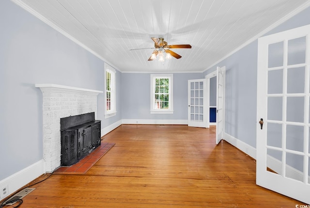 203 Lakeland Dr, Conway, SC 29526 - unfurnished living room with crown molding, ceiling fan, wood-type flooring, and a brick fireplace