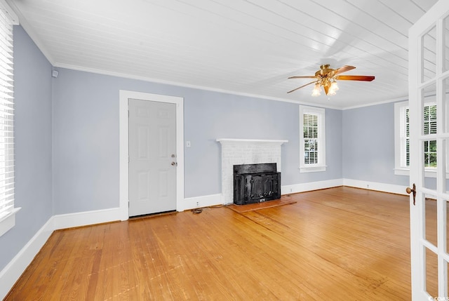 203 Lakeland Dr, Conway, SC 29526 - unfurnished living room with wood finished floors, ceiling fan, a fireplace, and ornamental molding
