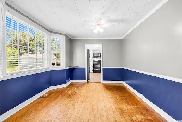 203 Lakeland Dr, Conway, SC 29526 - empty room with wood-type flooring, a ceiling fan, and crown molding