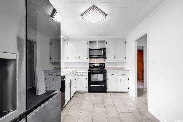 203 Lakeland Dr, Conway, SC 29526 - kitchen with black appliances, ornamental molding, light countertops, white cabinets, and light tile patterned floors