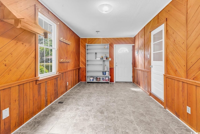 203 Lakeland Dr, Conway, SC 29526 - empty room featuring wood walls and stone finish floors