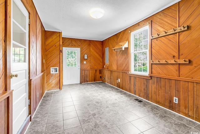 203 Lakeland Dr, Conway, SC 29526 - empty room featuring wood walls and a textured ceiling