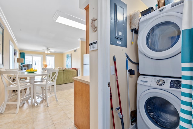 5000 N Ocean Blvd Unit E-2, North Myrtle Beach, SC 29582 - washroom with electric panel, stacked washer / dryer, ornamental molding, light tile patterned floors, and ceiling fan