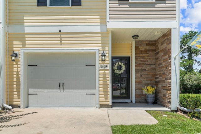 1428 Lanterns Rest Rd Unit 1428, Myrtle Beach, SC 29579 - view of exterior entry featuring concrete driveway and a garage