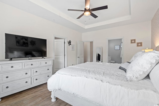 1428 Lanterns Rest Rd Unit 1428, Myrtle Beach, SC 29579 - bedroom with wood finished floors, a tray ceiling, and ceiling fan