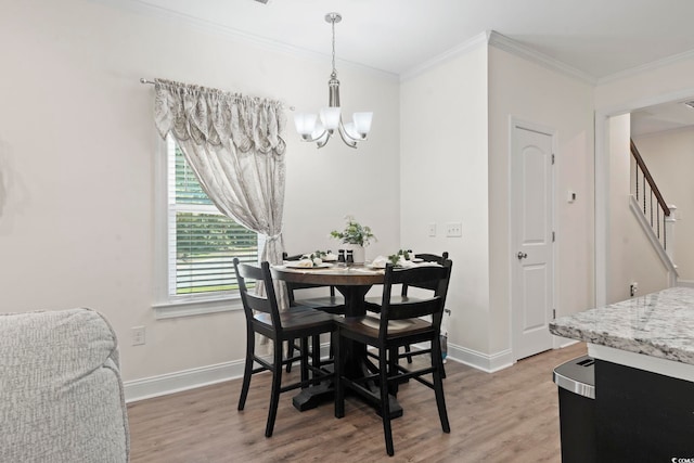 1428 Lanterns Rest Rd Unit 1428, Myrtle Beach, SC 29579 - dining space featuring light wood-style floors, crown molding, a chandelier, and stairs