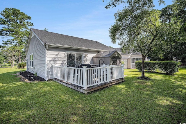 6570 Pebble Beach Cres, Myrtle Beach, SC 29588 - rear view of property with a storage unit, a deck, a lawn, and a shingled roof