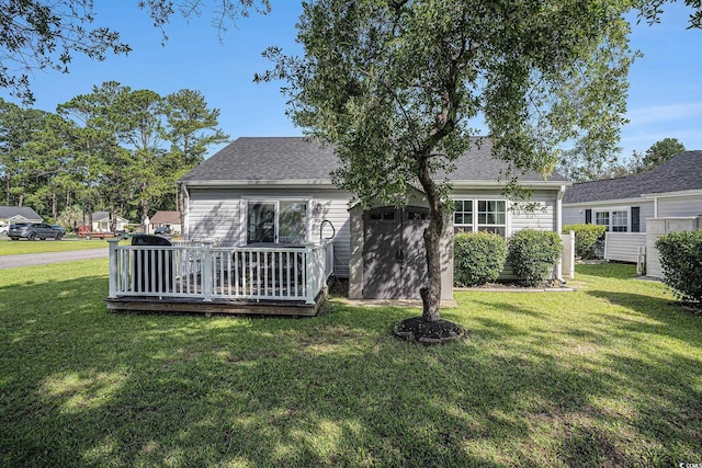 6570 Pebble Beach Cres, Myrtle Beach, SC 29588 - rear view of house with a lawn, a deck, and roof with shingles