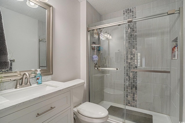 6570 Pebble Beach Cres, Myrtle Beach, SC 29588 - bathroom featuring a textured ceiling, a shower stall, and vanity